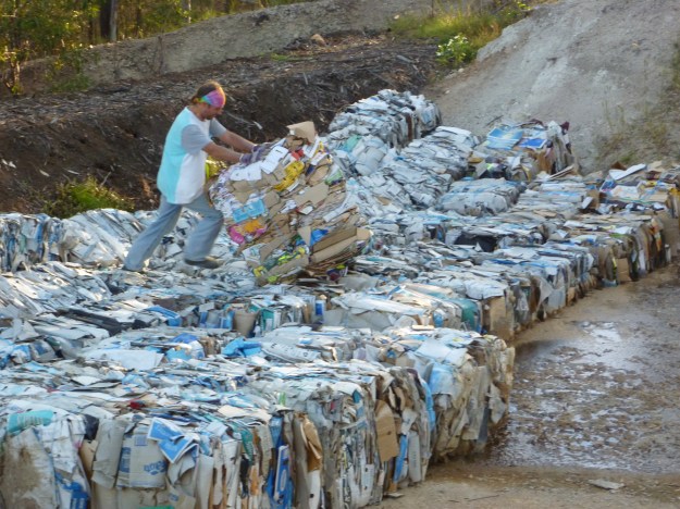 We place used cardboard into a dam-like depression created in depleted part of the property. The depression collects moisture.