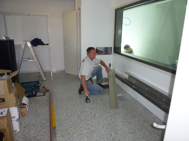 The guys working on wiring and desk installation today. Can you see Jesus in this picture?